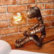 1-Light Industrial Robot Table Lamp - Antiqued Bronze Metal Nightstand Light For Bedroom