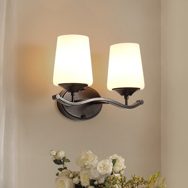 Ivory Glass Vanity Lighting With Iron Wavy Arm - Traditional Black Tapered Wall Light For Bedroom
