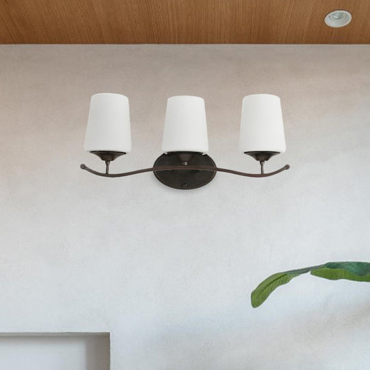 Ivory Glass Vanity Lighting With Iron Wavy Arm - Traditional Black Tapered Wall Light For Bedroom