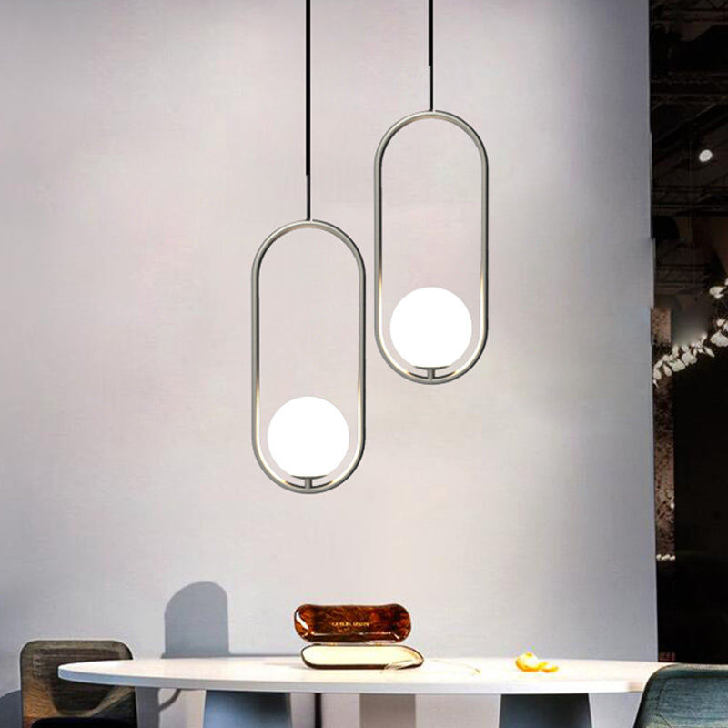 Sleek Chrome Oblong Pendant Light With Minimalist Design And Orb White Glass Shade