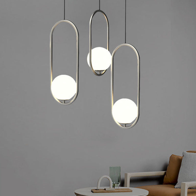 Sleek Chrome Oblong Pendant Light With Minimalist Design And Orb White Glass Shade