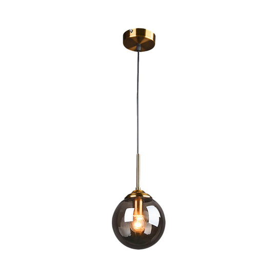 Sleek Brass Pendant Lamp With Amber/Smoke Glass Shade – Perfect For Dining Room Ceilings