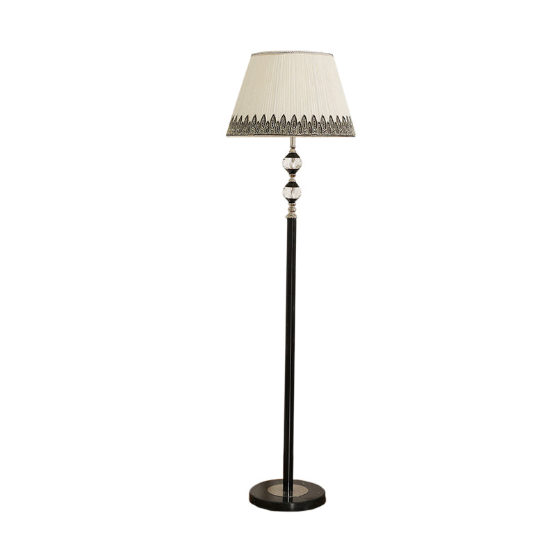 Modernist Black Floor Lamp With Clear Crystal Globe Base And Barrel Fabric Shade