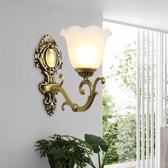 Vintage Brass/Beige Frosted Ribbed Glass Wall Sconce Lamp With Curvy Arm - 1 Light Bloom