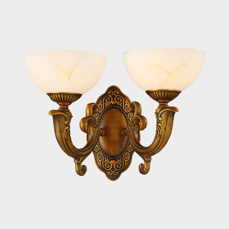 Rustic Brass Wall Sconce With Frosted Glass Shade - Swooping Arm Design For Ambient Lighting