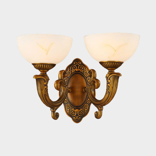 Rustic Brass Wall Sconce With Frosted Glass Shade - Swooping Arm Design For Ambient Lighting