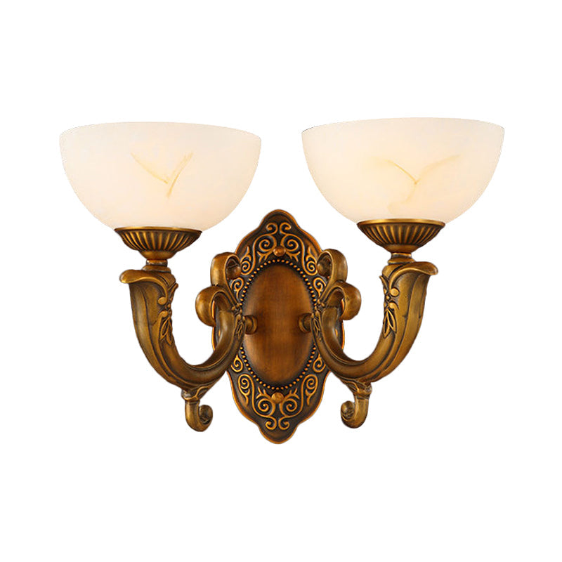 Rustic Brass Wall Sconce With Frosted Glass Shade - Swooping Arm Design For Ambient Lighting
