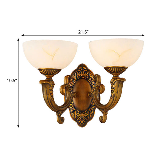 Rustic Brass Wall Sconce With Frosted Glass Shade - Swooping Arm Design For Ambient Lighting