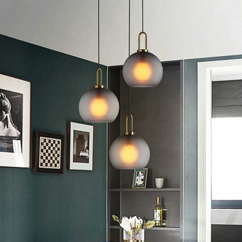 Modern Glass Sphere Pendant Light With Smoky Grey Frosted Finish Single-Bulb Brass Ceiling Hanging