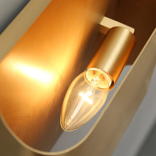 Gold Metal Led Wall Light With Modern Cut Geometry Ideal For Bedside Ambiance