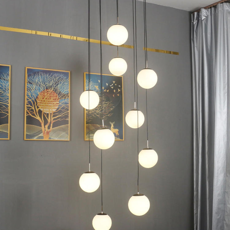 Modernist Cream Glass Ball Pendant Light With 10 Black Suspension Lamps - Perfect For Living Room