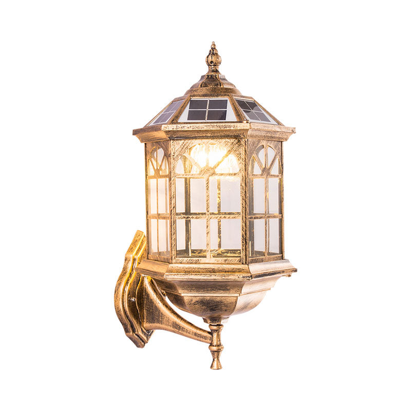 Traditional Outdoor Solar Wall Light Fixture With Metallic House Shaped Design And Clear Glass Shade