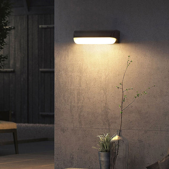 Minimalist Black Acrylic Led Wall Sconce For Yard - Capsule Shape