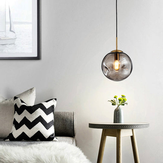 Postmodern Brass Pendant Lamp With Dimpled Glass Globe For Bedroom