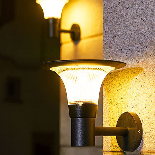 Sleek Black Solar Wall Light Fixture With Flared Design For Courtyard