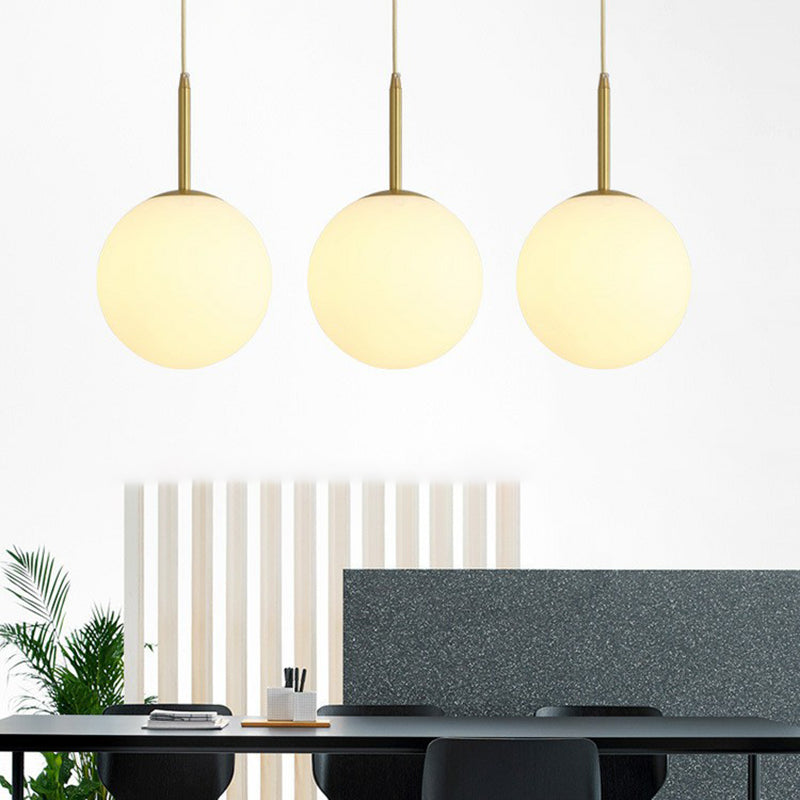 Minimalist Opal Glass Sphere Pendant Light With 3-Bulb Gold Pendulum Design - Ideal For Dining Room