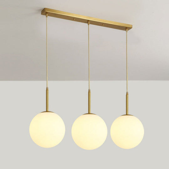 Minimalist Opal Glass Sphere Pendant Light With 3-Bulb Gold Pendulum Design - Ideal For Dining Room