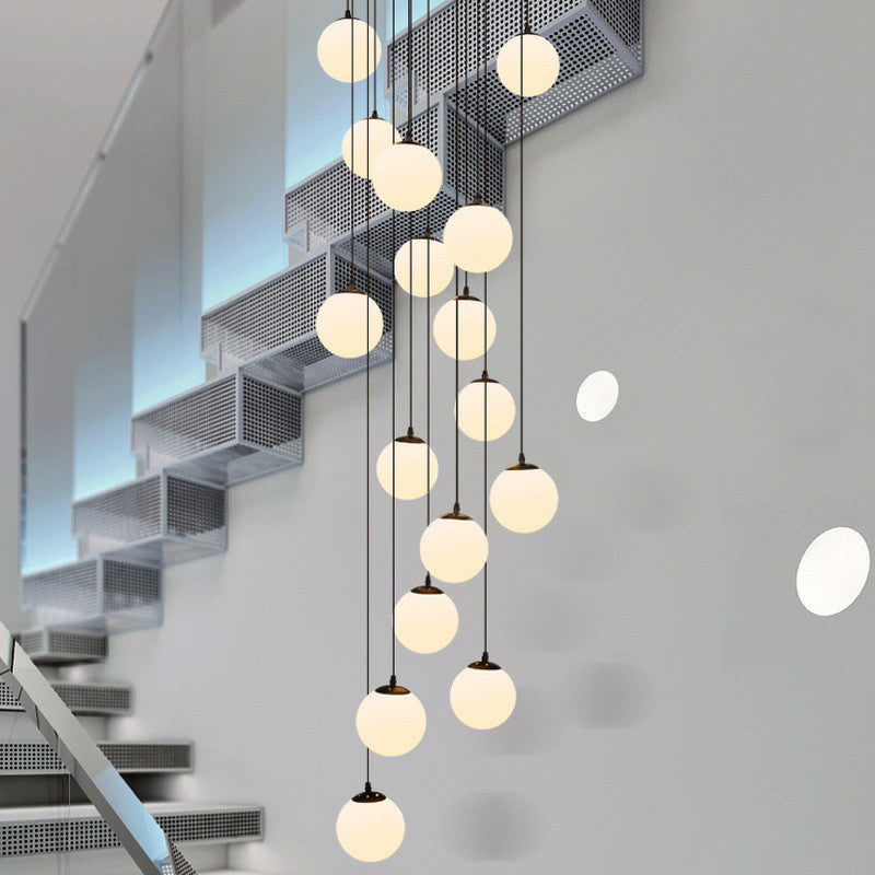 Minimalist Black Globe Pendant Light With Cream Glass - Ideal For Stairways