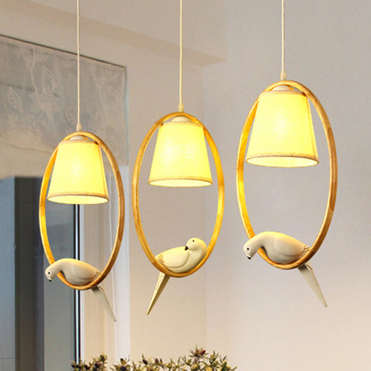 Contemporary Cone Pendant Light Fixture With Hanging Fabric Wood Ring And Resin Bird - 1/3 Lights
