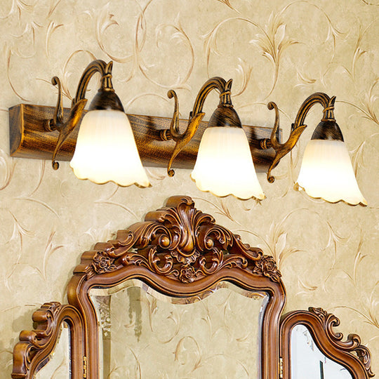 Bronze Wall Lamp With Country Flower Shade And White Rid Glass For Vanity Lighting