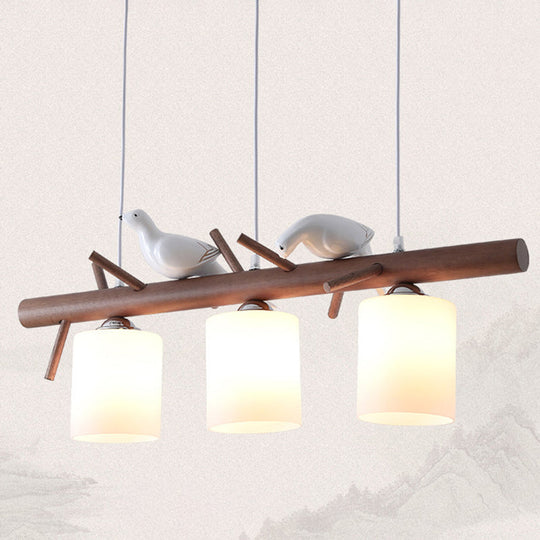 Contemporary Wood Island Pendant With Nutcracker Design And Cylindrical Glass Shades - Set Of 3