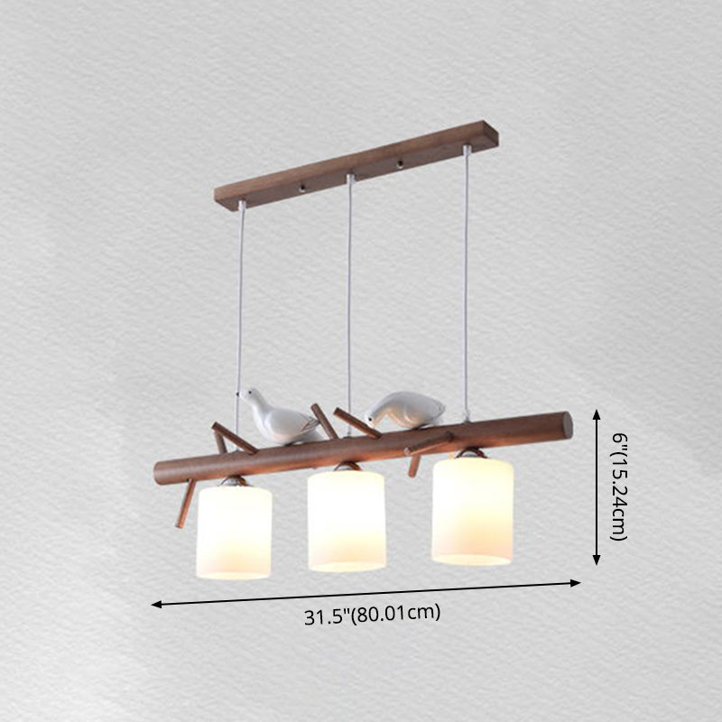 Contemporary Wood Island Pendant With Nutcracker Design And Cylindrical Glass Shades - Set Of 3