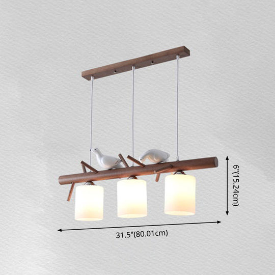 Contemporary Wood Island Pendant With Nutcracker Design And Cylindrical Glass Shades - Set Of 3