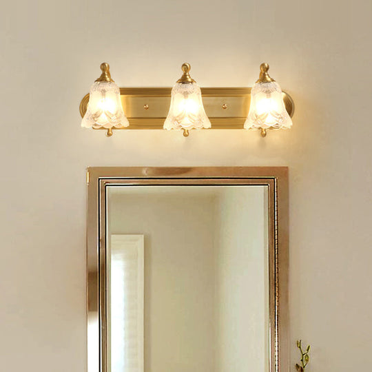 Brass Armed Wall Sconce With Ribbed Glass Shade For Bathroom Decoration