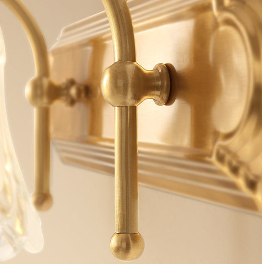 Brass Armed Wall Sconce With Ribbed Glass Shade For Bathroom Decoration