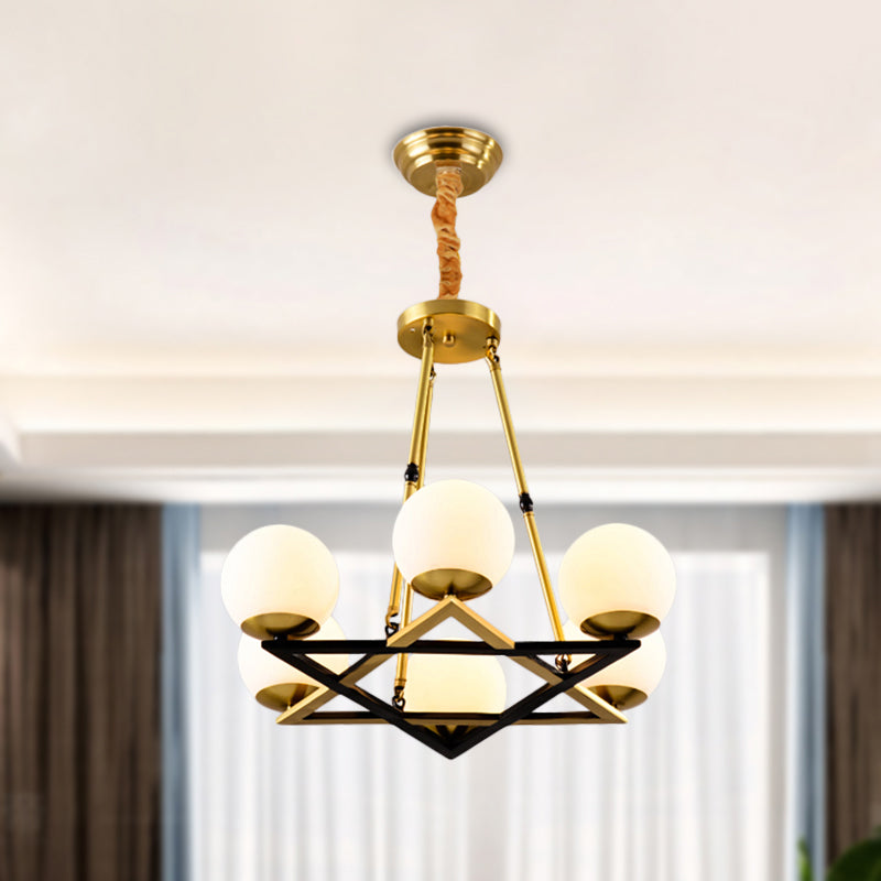 Postmodern Polygon Metal Chandelier With Brass Finish And Globe White Glass Shades