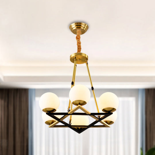 Postmodern Polygon Metal Chandelier With Brass Finish And Globe White Glass Shades