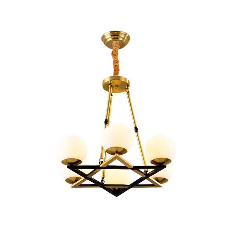 Postmodern Polygon Metal Chandelier With Brass Finish And Globe White Glass Shades