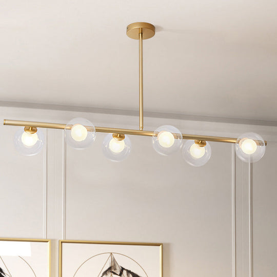 Nordic Metal 6-Head Linear Island Light With Gold Finish And Clear Glass Globes