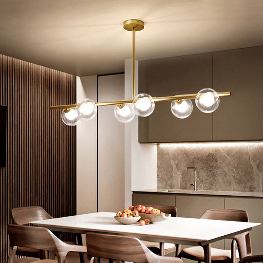 Nordic Metal 6-Head Linear Island Light With Gold Finish And Clear Glass Globes