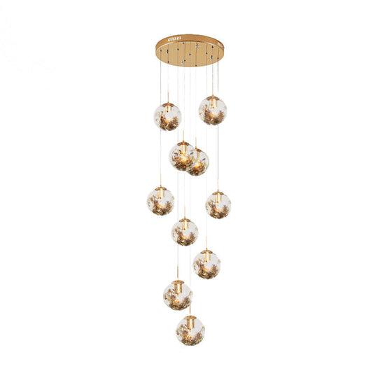 Contemporary Gold Ball Chandelier With Amber Dimpled Glass Pendant - 10 Bulbs Multi-Light For