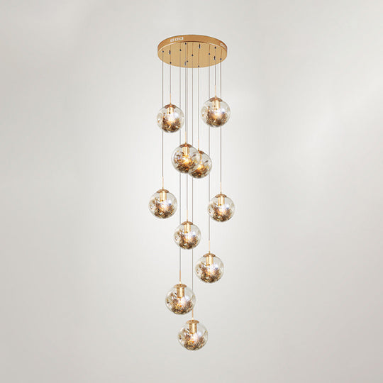 Contemporary Gold Ball Chandelier With Amber Dimpled Glass Pendant - 10 Bulbs Multi-Light For