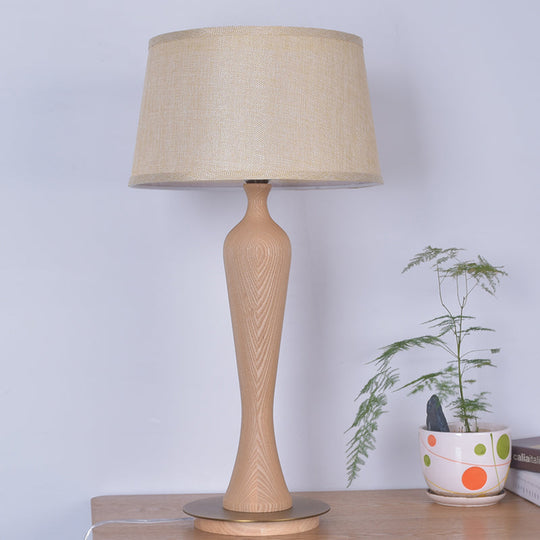 Modern Urn-Shaped Wood Desk Lamp In Beige - 1 Bulb Table Light With Drum Fabric Shade