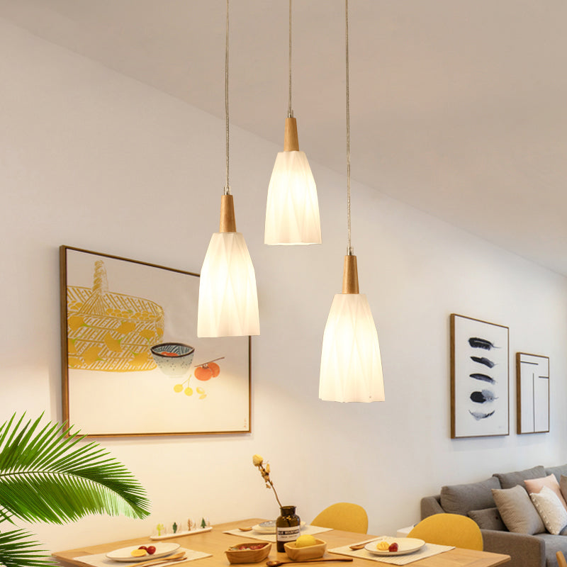Japanese 3-Light Glass Pendant With Prismatic Cluster In White Hangs From Wood Canopy