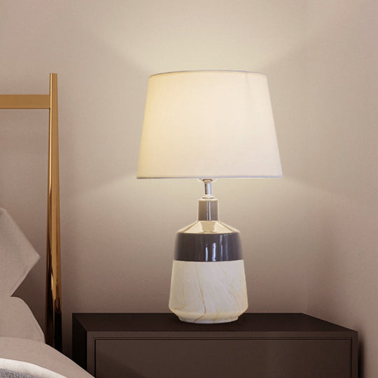 Contemporary 1-Head Bedside Night Lamp In White With Ceramic Base: Fabric Drum Table Lighting