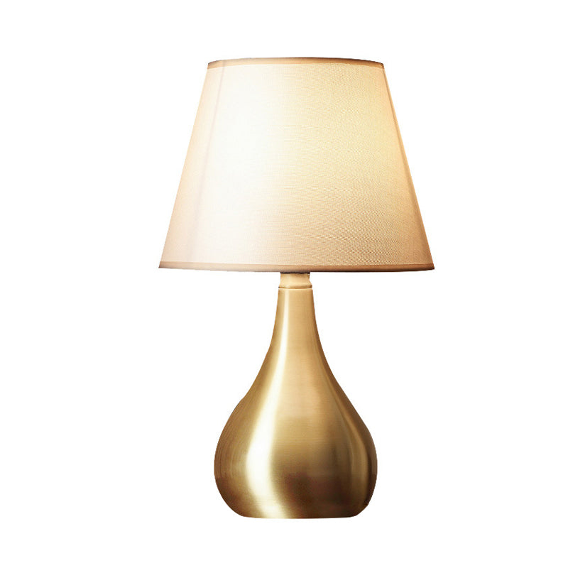 Sleek Metallic Urn-Shape Table Light - Simplicity 1-Light Brass Finish Lamp With Barrel Fabric Shade