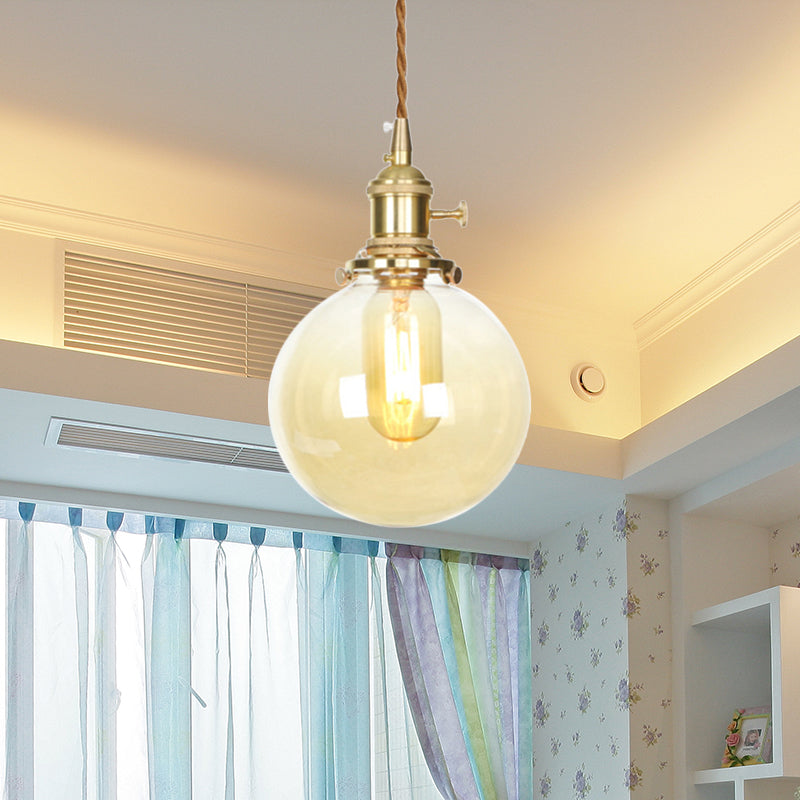 1-Light Amber Pendant Light With Adjustable Cord And Globe Glass Shade - Industrial Indoor Lighting
