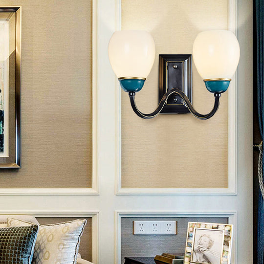 Rustic Globe Half-Wall Light With Blue Opal Glass And Curved Arm