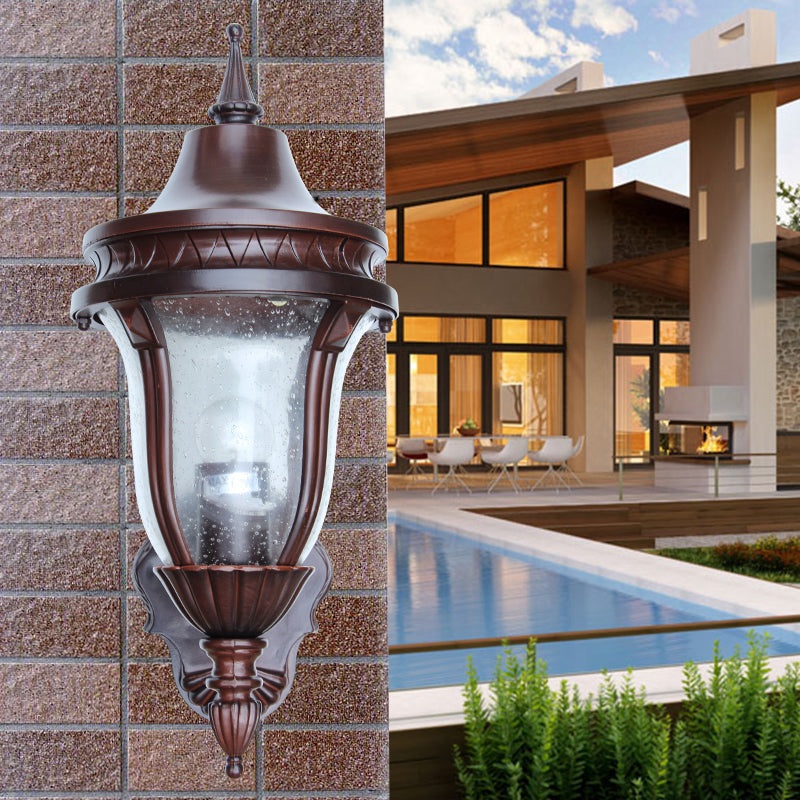 Clear Seedy Glass Wall Lamp With Retro Rust Urn Shade - Outdoor Lighting Idea