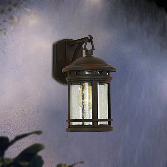 Rustic Outdoor Wall Lantern Sconce With Clear Seeded Glass Metal Frame In Coffee/Black - 1 Light