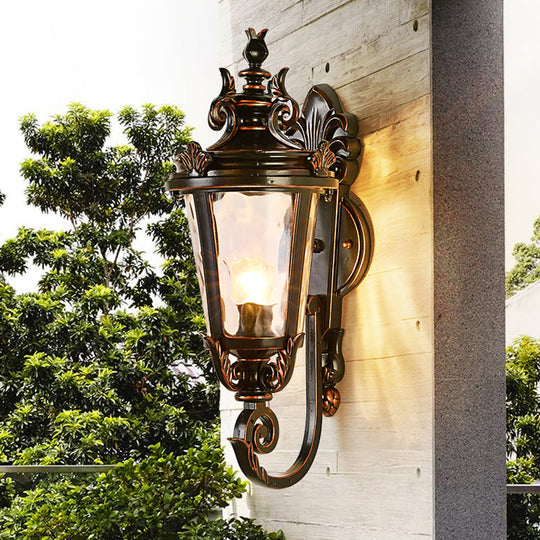 Clear Water Glass Outdoor Wall Sconce: Scrolled Arm 1-Light Black & Gold Lodge Lighting Black-Gold
