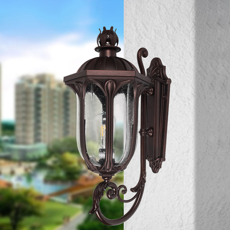 Lodge 1-Head Courtyard Wall Light Fixture With Seedy Glass And Swooping Arm In Dark Coffee