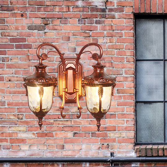 Countryside Black/Gold-Copper Urn Wall Sconce Light With Clear Glass - 2 Bulbs