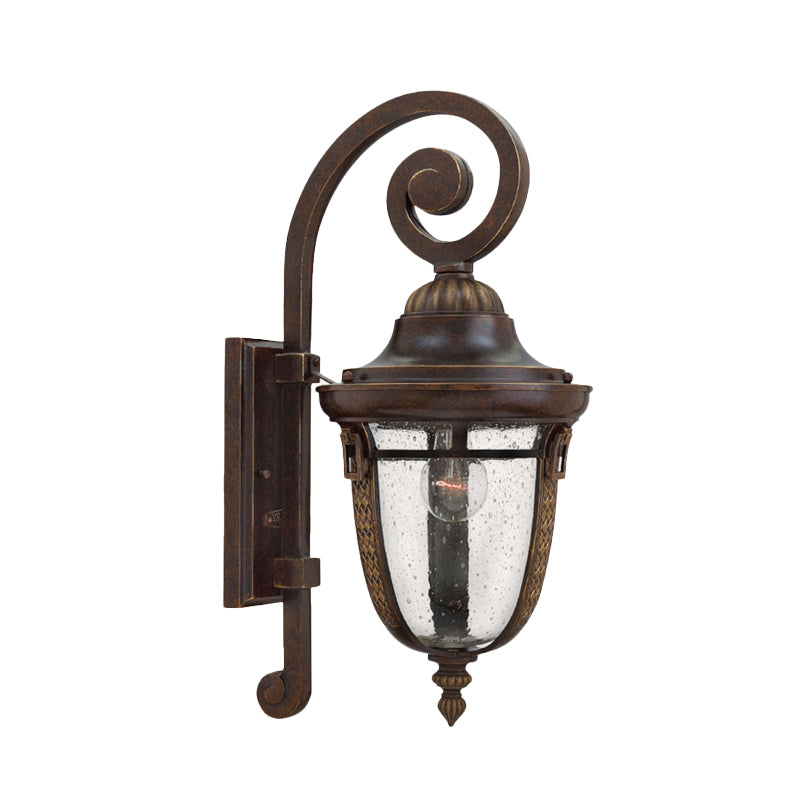 Rustic Bronze Scrolling Arm Metal Wall Lamp - 1 Light Outdoor Sconce With Seedy Glass Shade