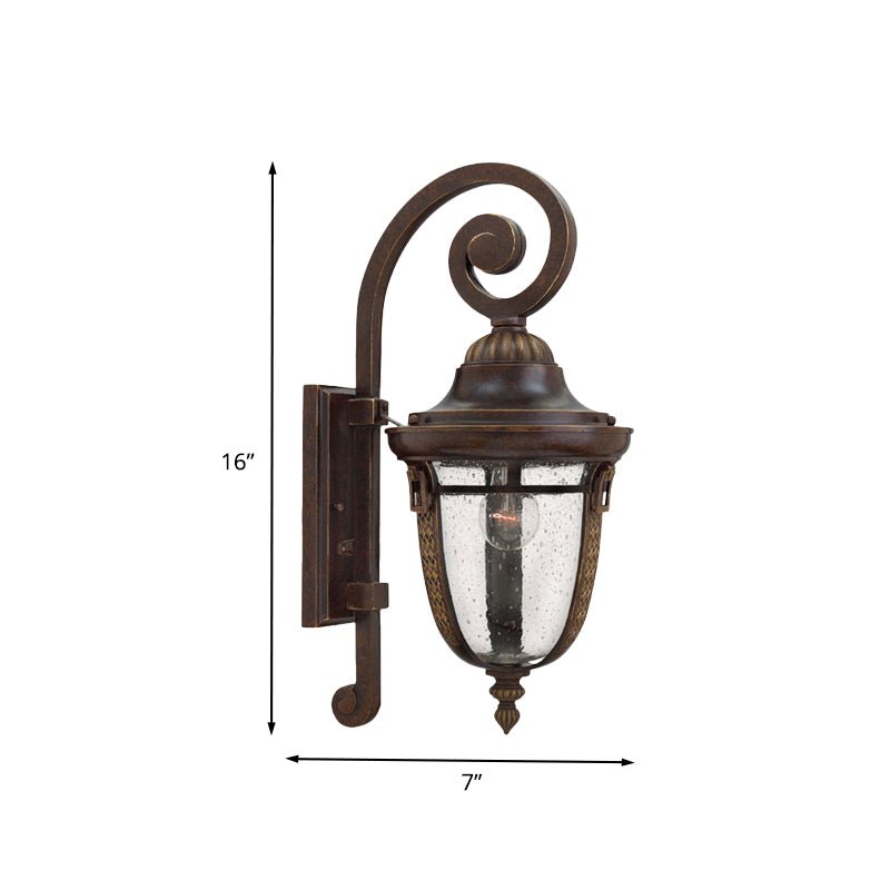 Rustic Bronze Scrolling Arm Metal Wall Lamp - 1 Light Outdoor Sconce With Seedy Glass Shade