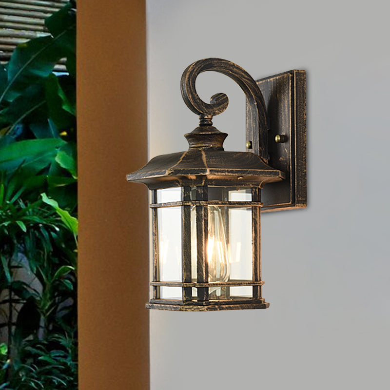 Bronze Curvy Arm Outdoor Wall Sconce With Clear Ripple Glass
